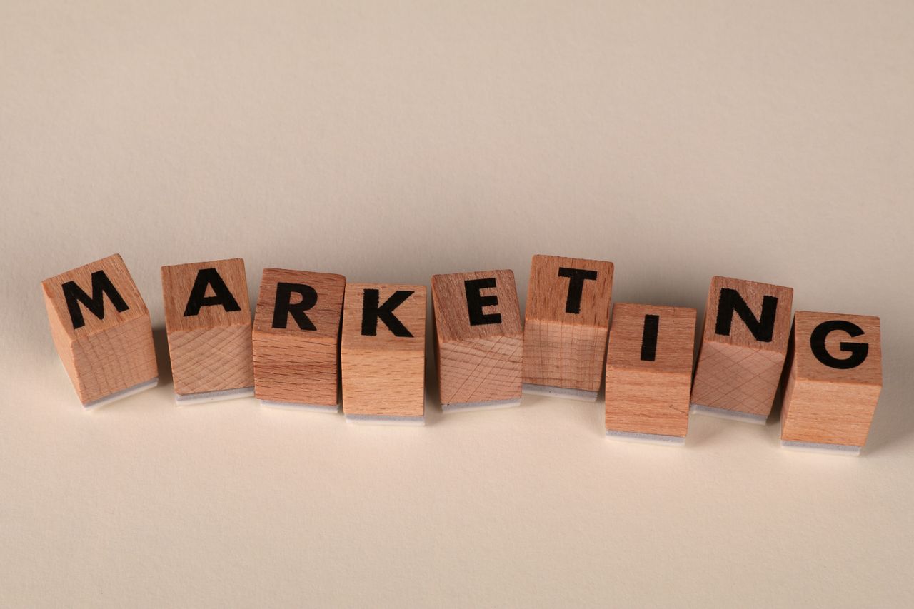 Wooden blocks with letters spelling 'marketing', ideal for business and advertising visuals.